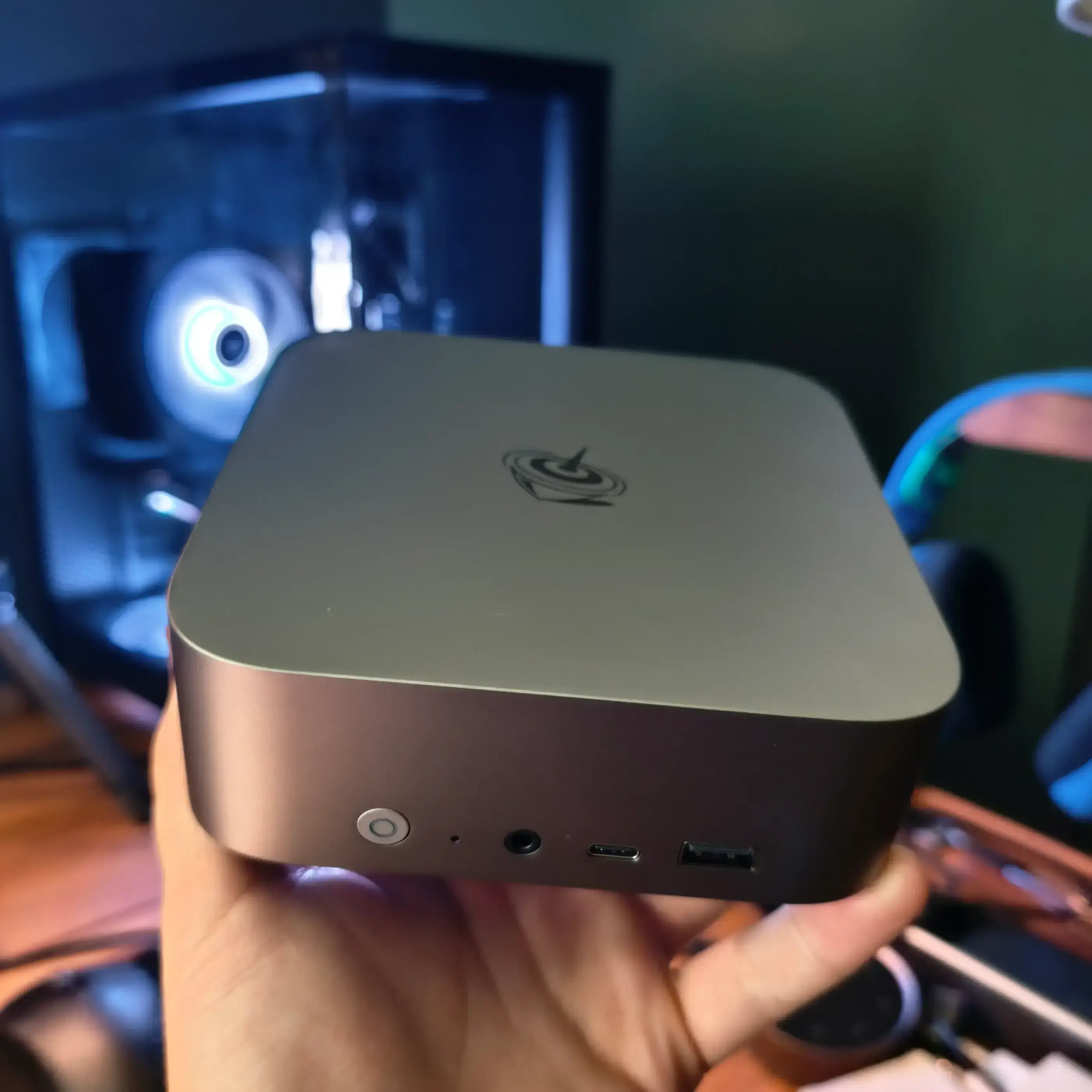 My Beelink SER9 MAX Linux mini PC resting in my hand.